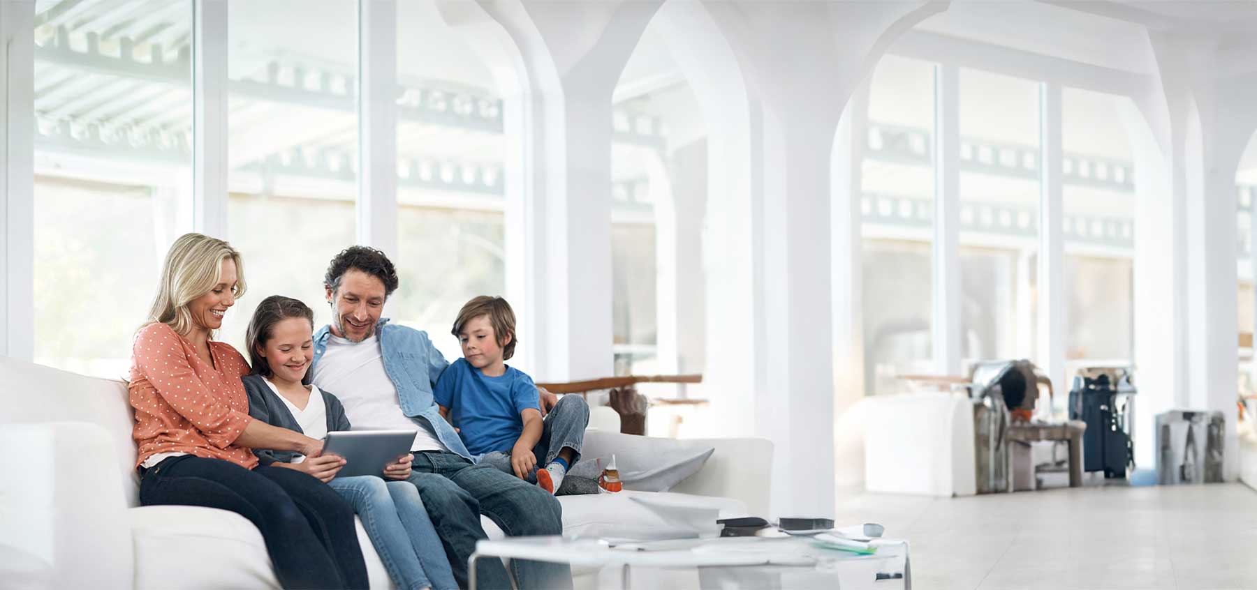 Family sitting together on a couch