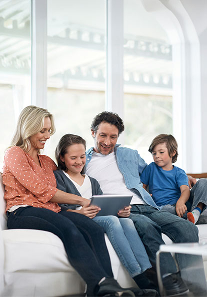 Family sitting together on a couch